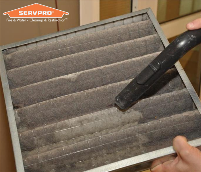 An air filter being cleaned 