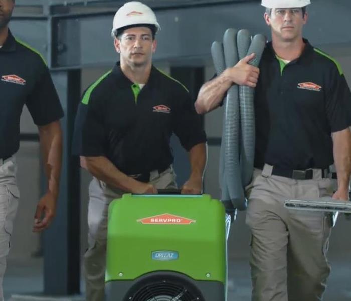 SERVPRO employees with machines